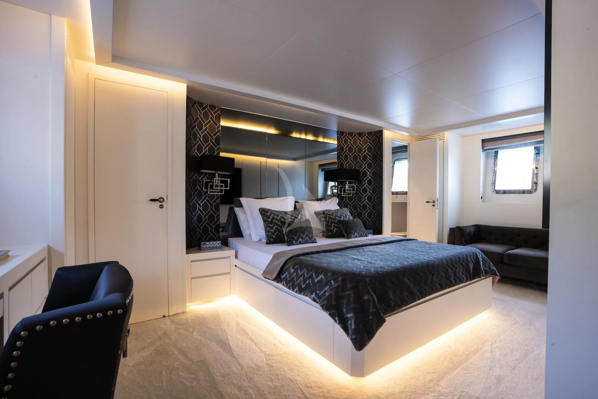 a bedroom with a large bed aboard EVA Yacht for Charter