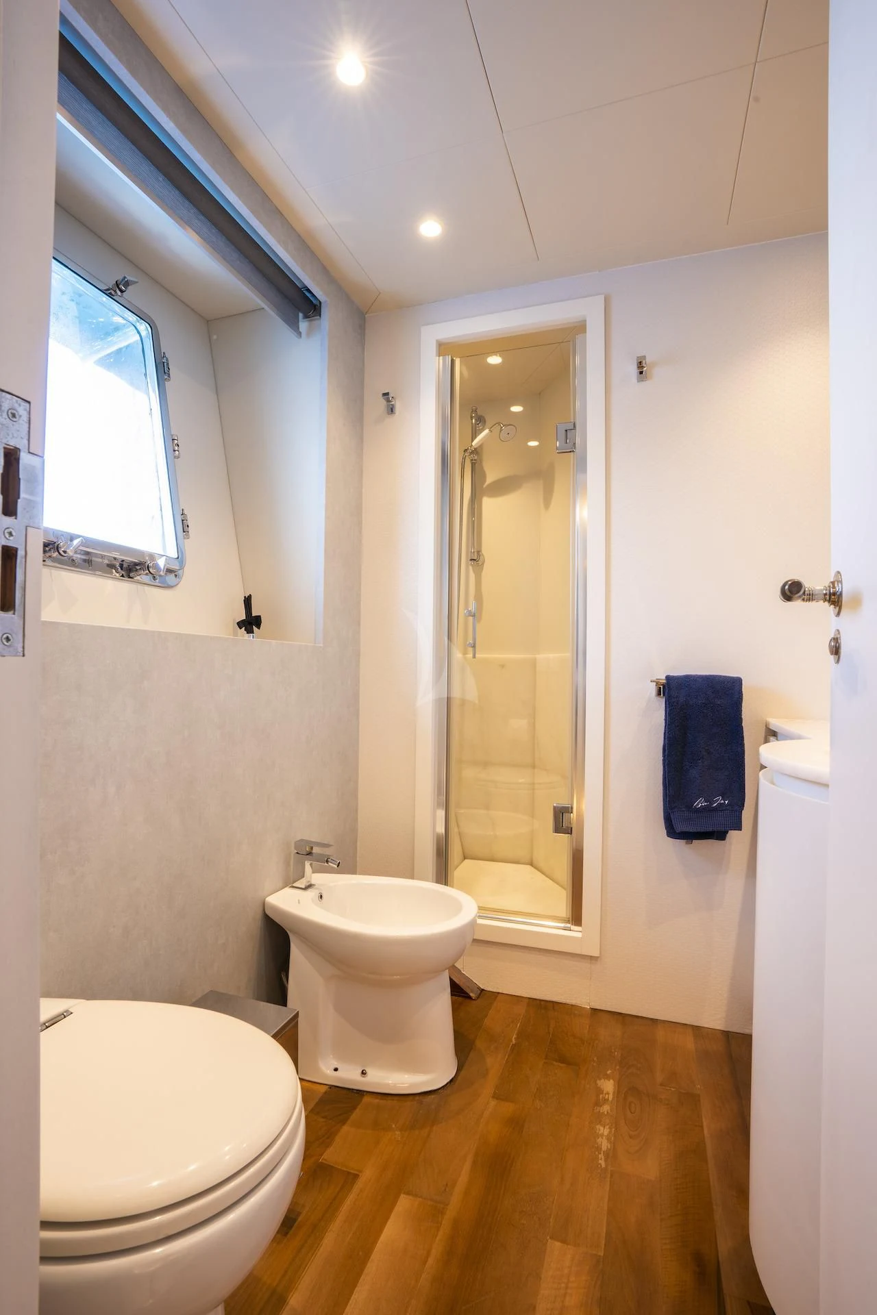 a bathroom with a large mirror aboard EVA Yacht for Charter