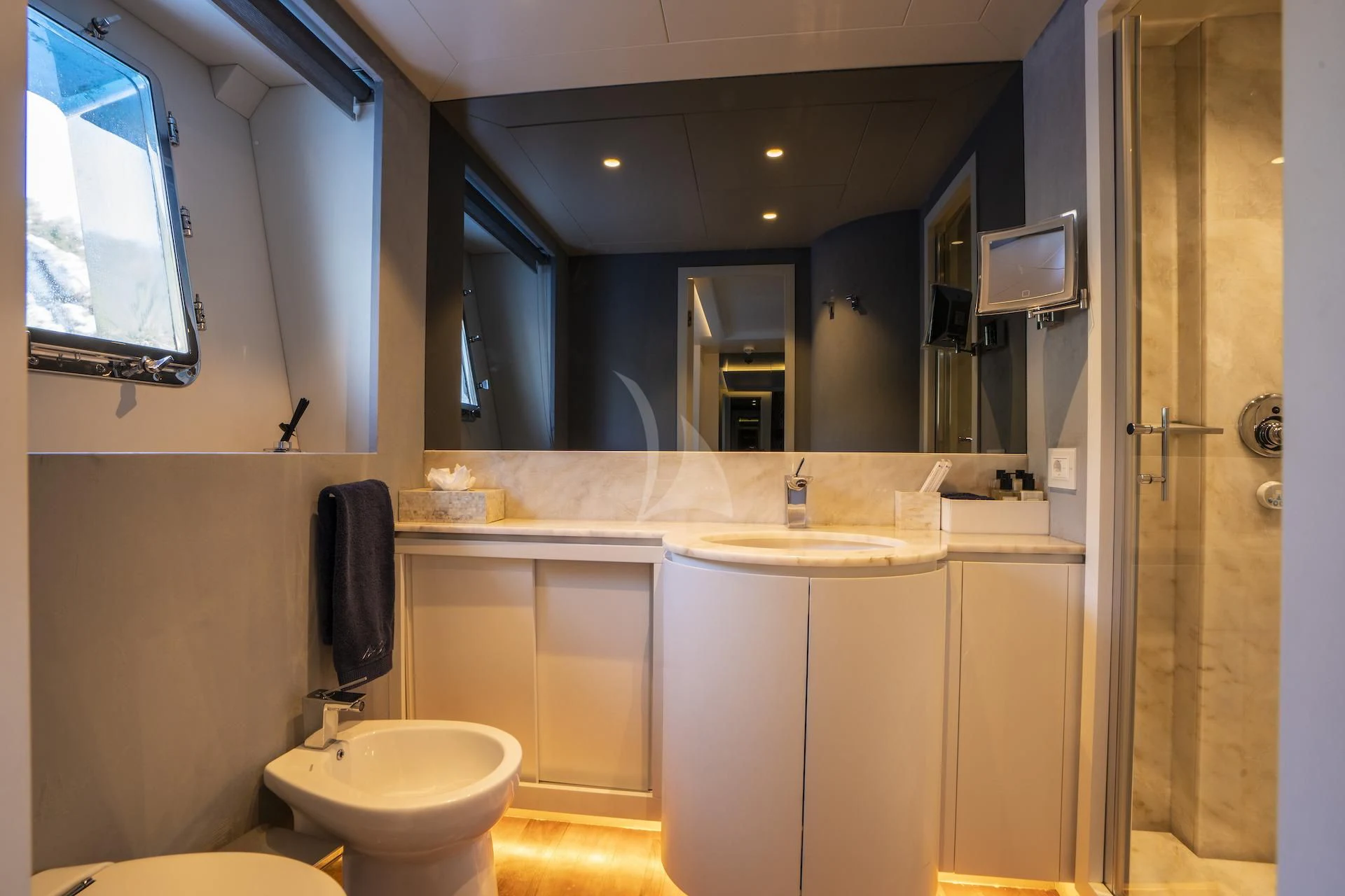 a bathroom with a sink and a mirror aboard EVA Yacht for Charter