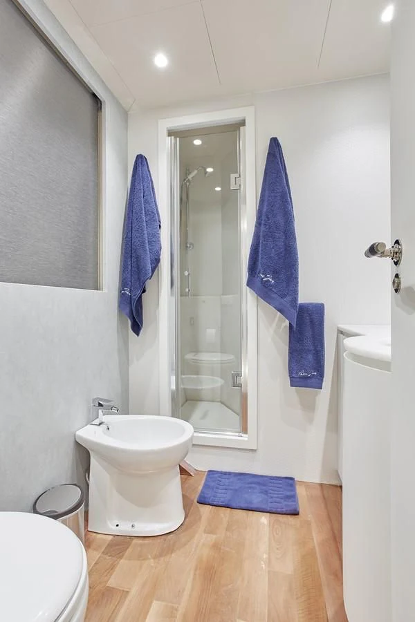 a bathroom with a shower and sink aboard EVA Yacht for Charter