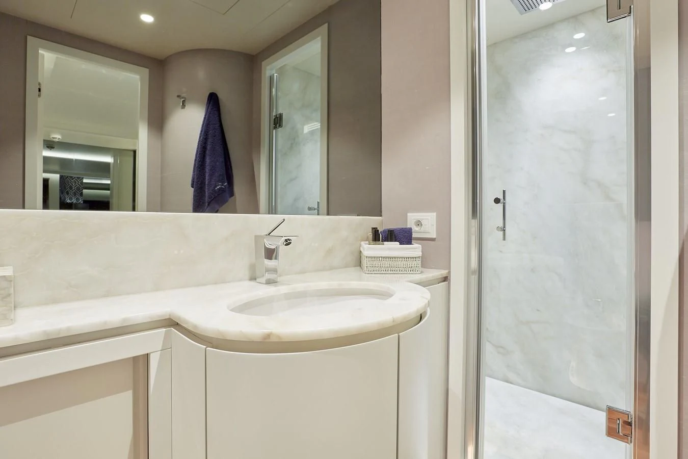 a bathroom with a sink and a shower aboard EVA Yacht for Charter