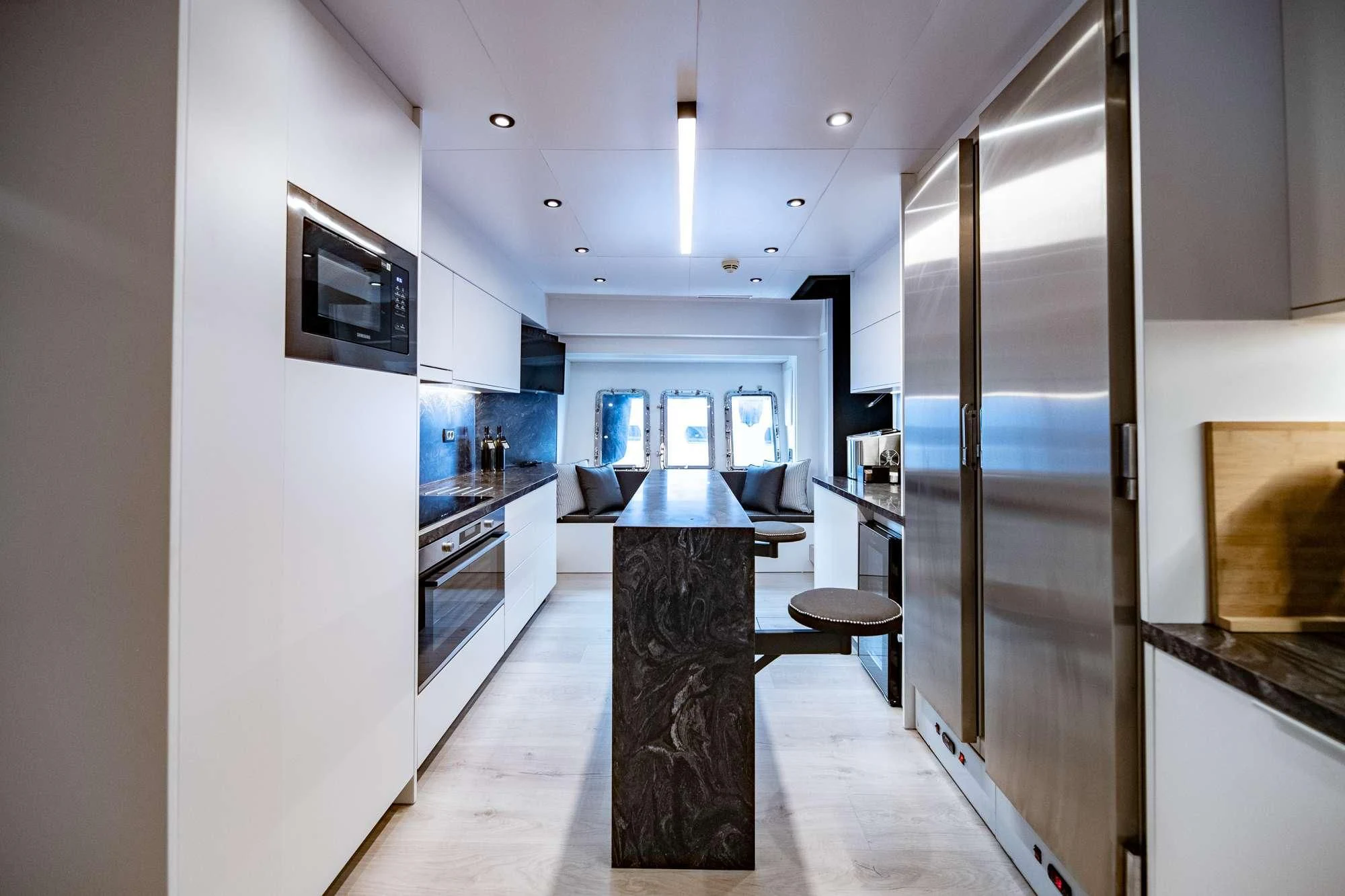 a kitchen with a large glass door aboard EVA Yacht for Charter