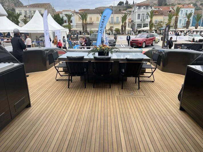 a table with a chair and a blue object on it aboard EVA Yacht for Charter