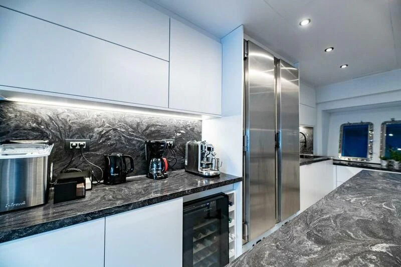 a kitchen with a glass door aboard EVA Yacht for Charter