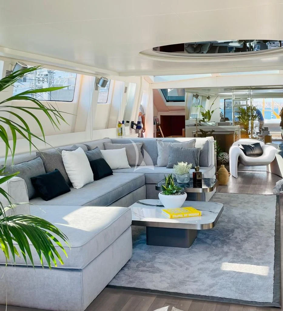 a living room with a couch and a table aboard EVA Yacht for Charter