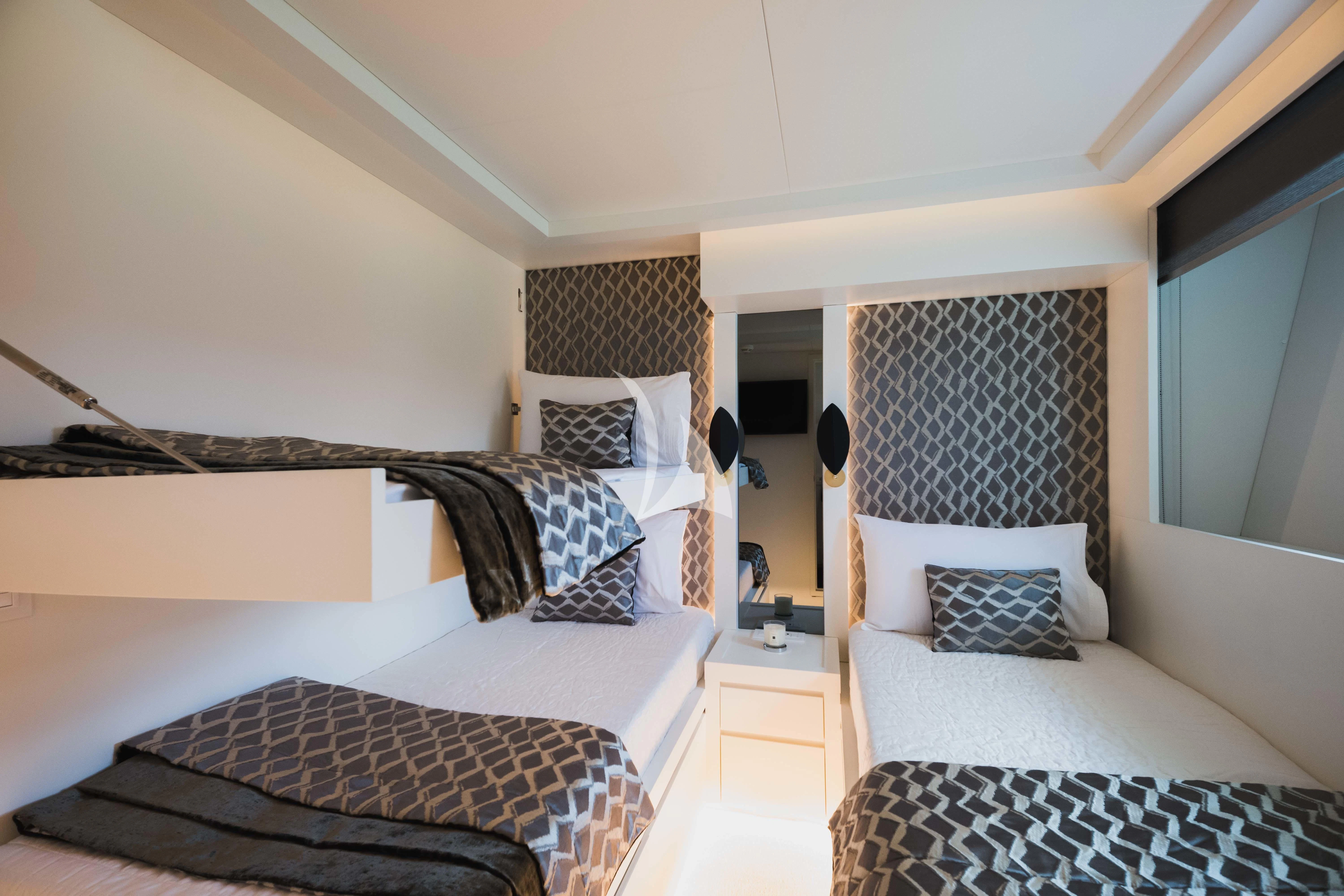 a room with two beds aboard EVA Yacht for Charter