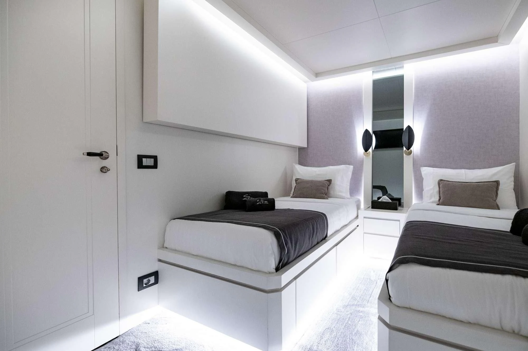 a room with two beds aboard EVA Yacht for Charter