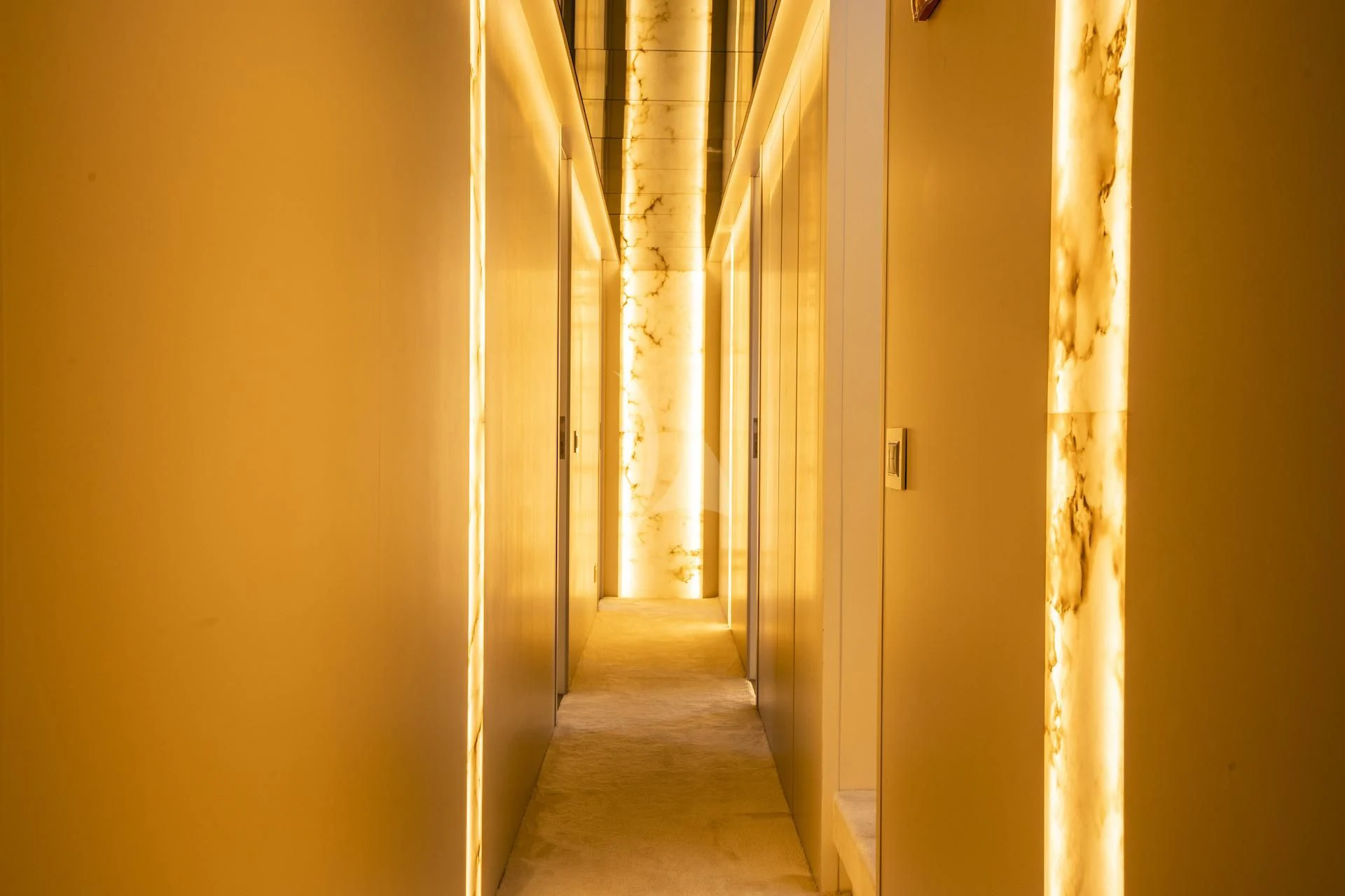 a hallway with white walls aboard EVA Yacht for Charter