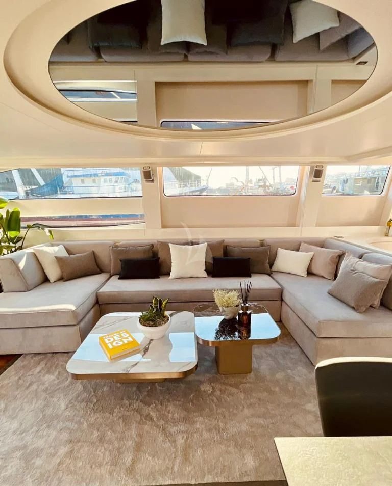 a living room with a couch and a coffee table aboard EVA Yacht for Charter