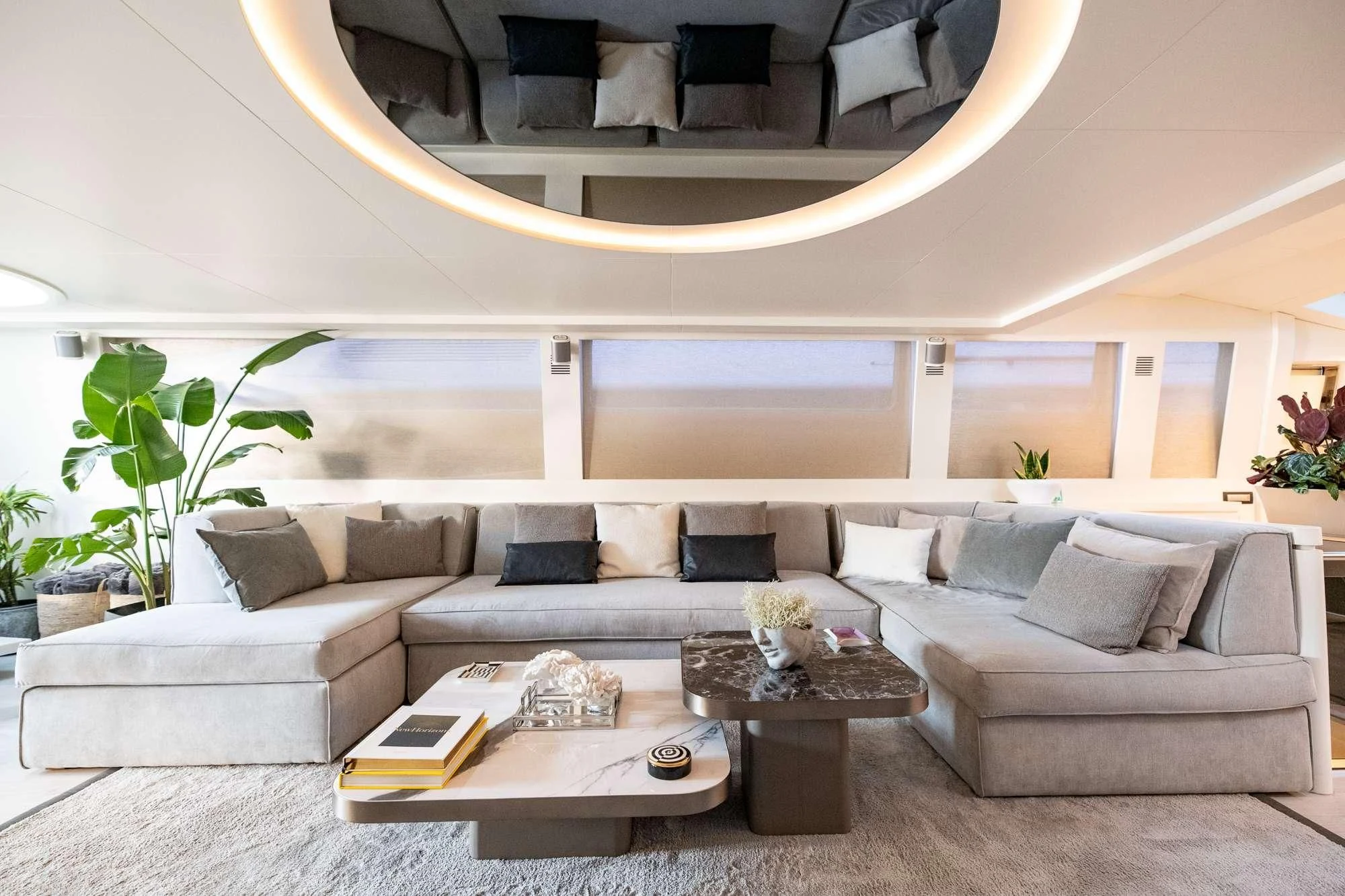 a living room with a couch and a coffee table aboard EVA Yacht for Charter