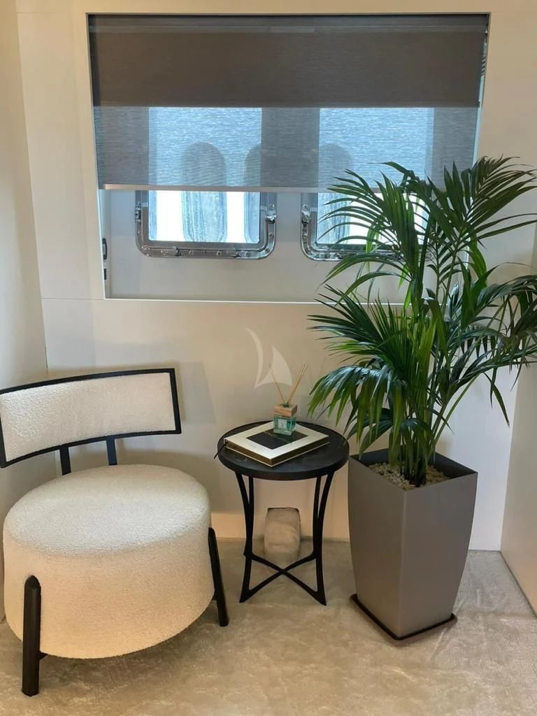 a room with a table and chairs aboard EVA Yacht for Charter