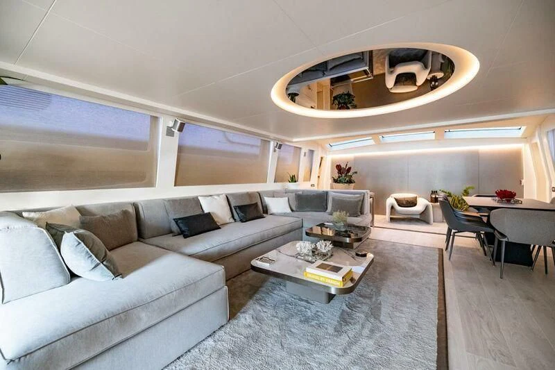 a living room with a couch and a coffee table aboard EVA Yacht for Charter