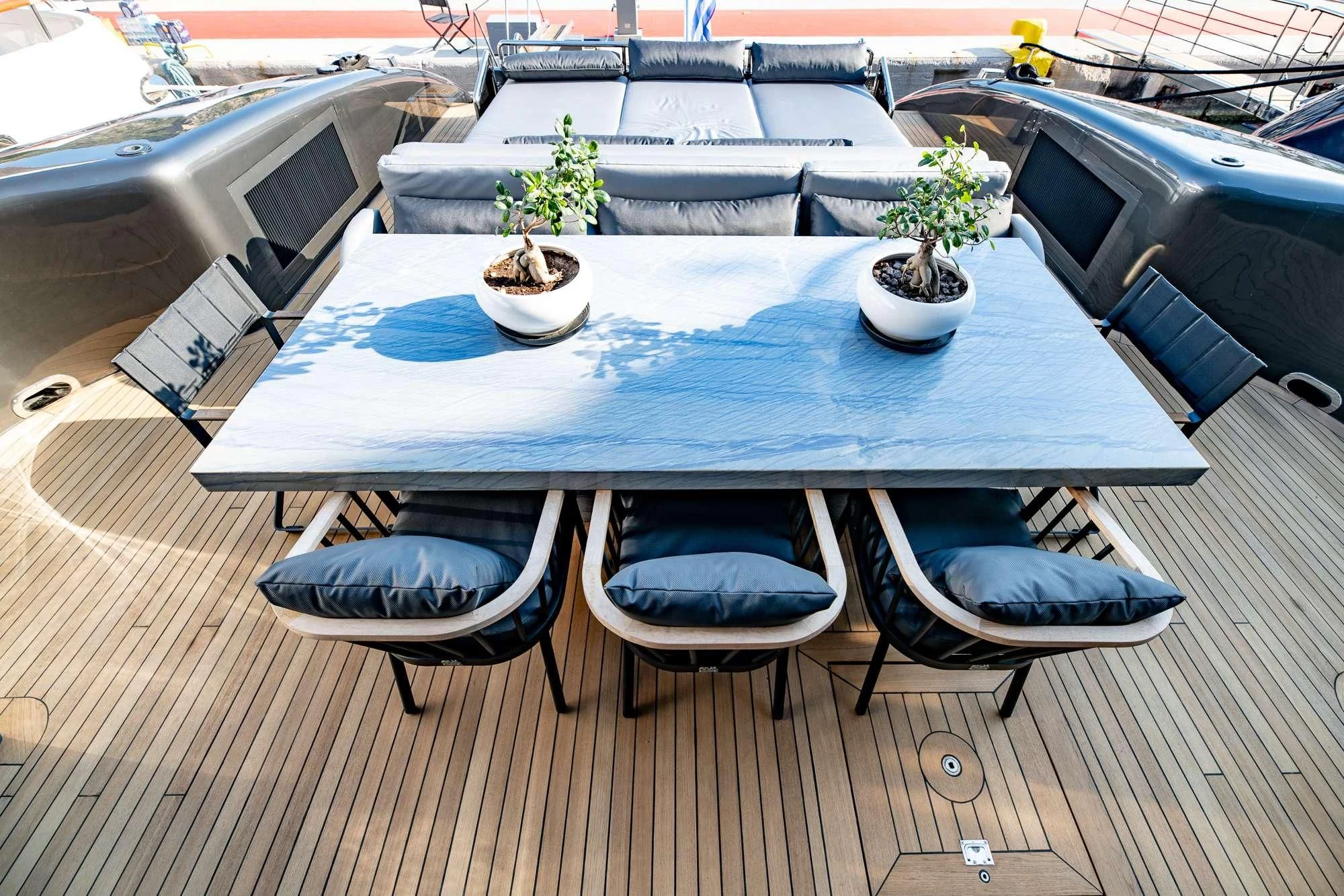 a table with chairs around it aboard EVA Yacht for Charter