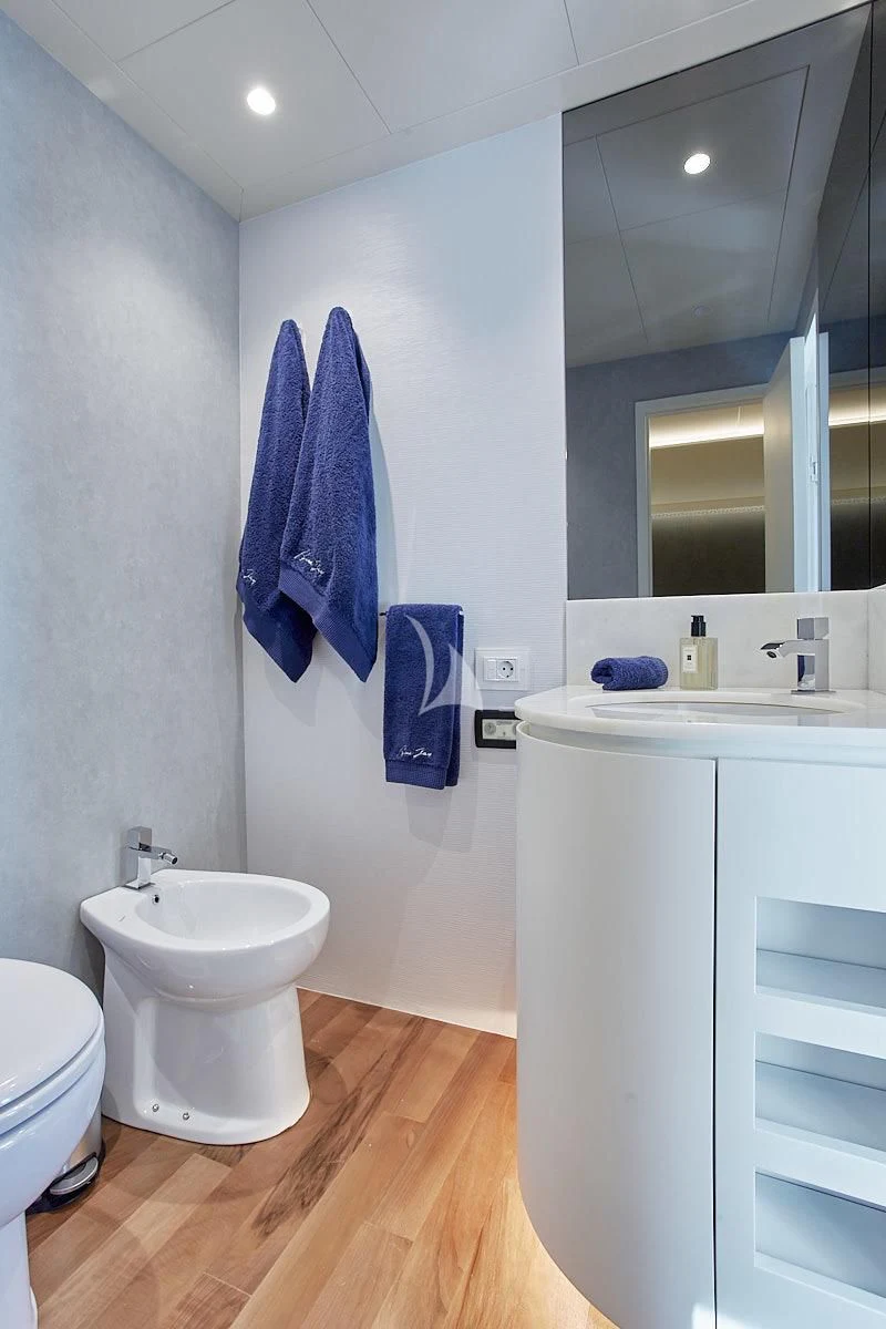 a bathroom with a sink and a mirror aboard EVA Yacht for Charter