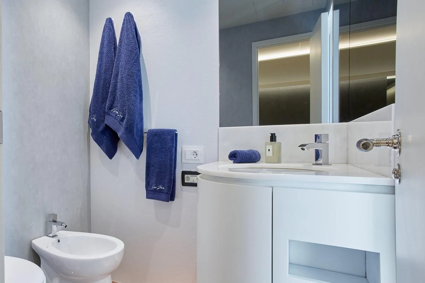 a bathroom with a sink and a mirror aboard EVA Yacht for Charter