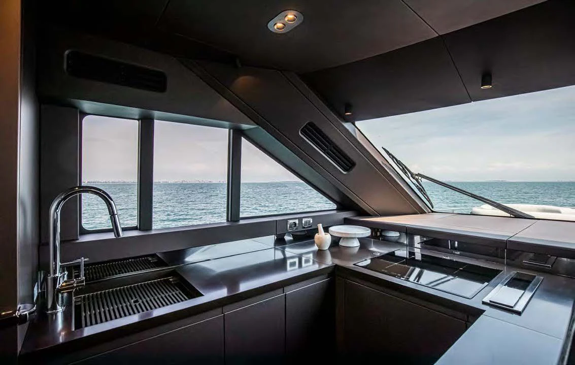 a kitchen with a view of the ocean aboard SESSANTASETTE 67 Yacht for Sale