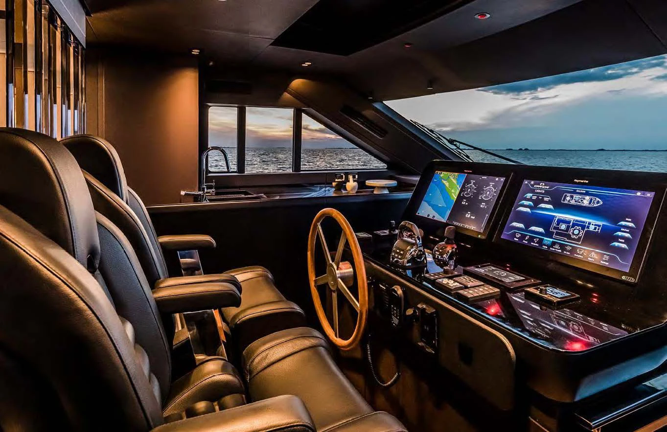 inside of a car with many screens aboard SESSANTASETTE 67 Yacht for Sale