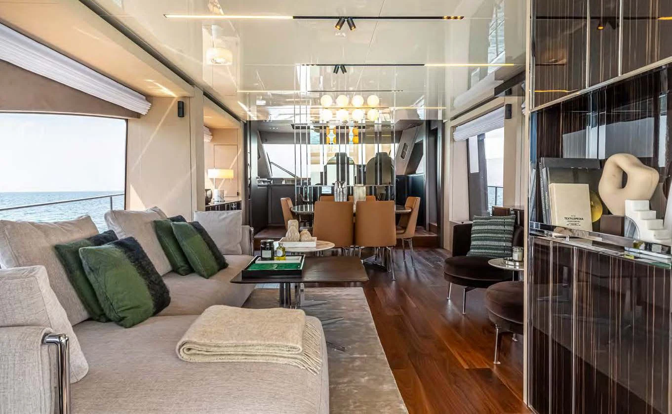 a living room with a large window aboard SESSANTASETTE 67 Yacht for Sale