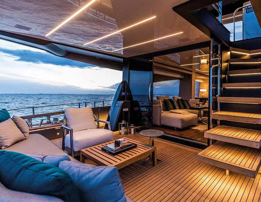 a room with a view of the ocean and the deck aboard SESSANTASETTE 67 Yacht for Sale