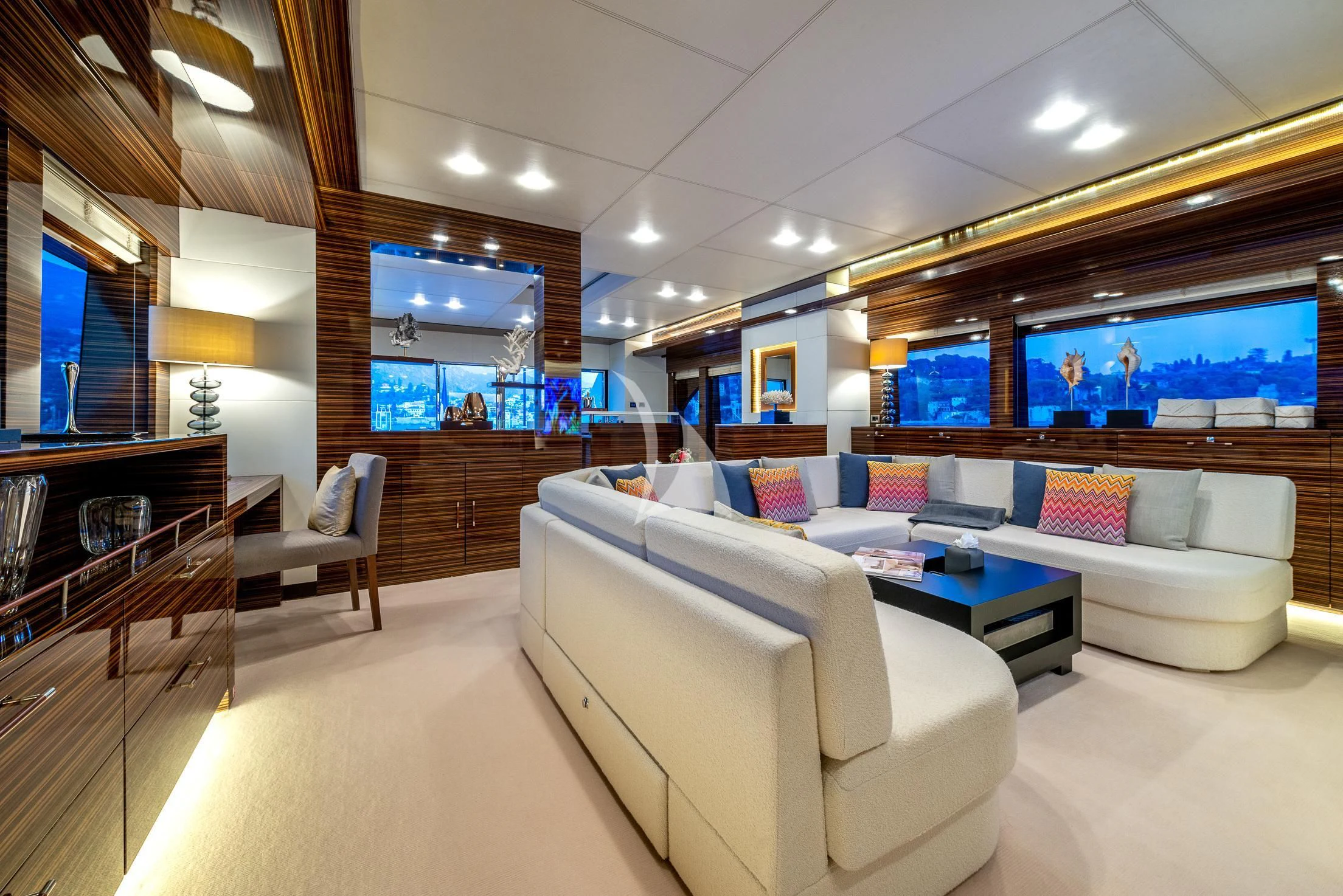 a living room with a couch and a table aboard GEMS 2 Yacht for Sale