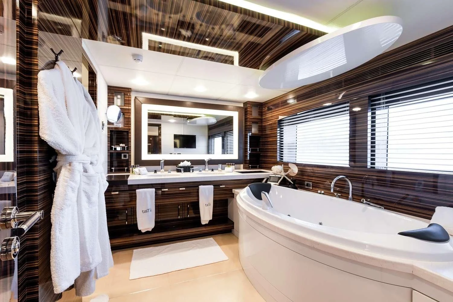 a bathroom with a bathtub and sink aboard GEMS 2 Yacht for Sale