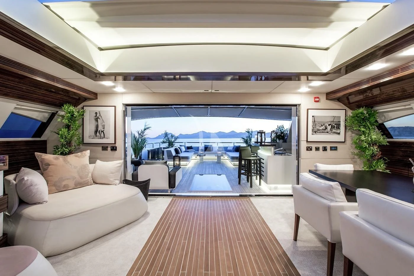 a living room with a large window aboard GEMS 2 Yacht for Sale