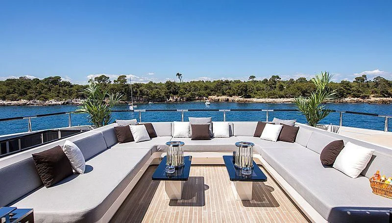 a patio with a pool and trees aboard GEMS 2 Yacht for Sale
