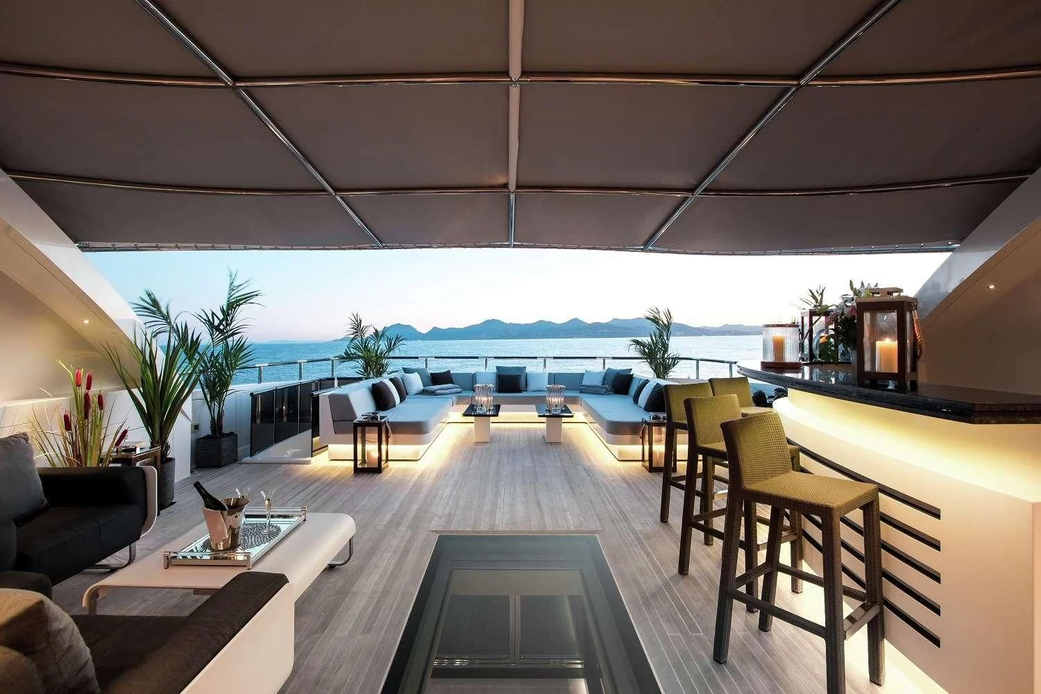 a room with a table chairs and a view of the ocean aboard GEMS 2 Yacht for Sale