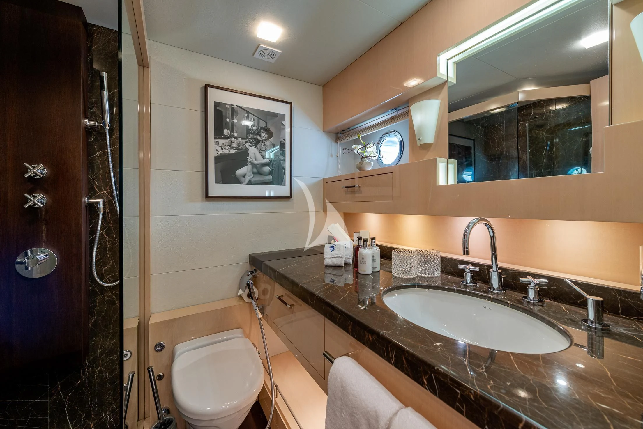 a bathroom with a sink and a mirror aboard GEMS 2 Yacht for Sale