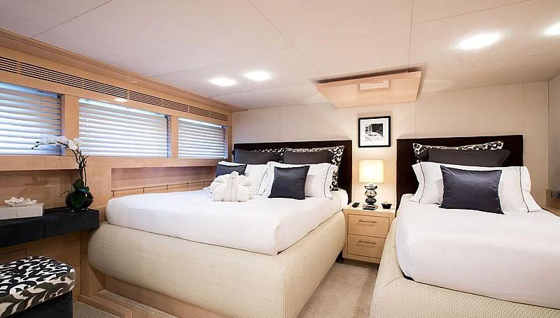 a couple of beds in a hotel room aboard GEMS 2 Yacht for Sale
