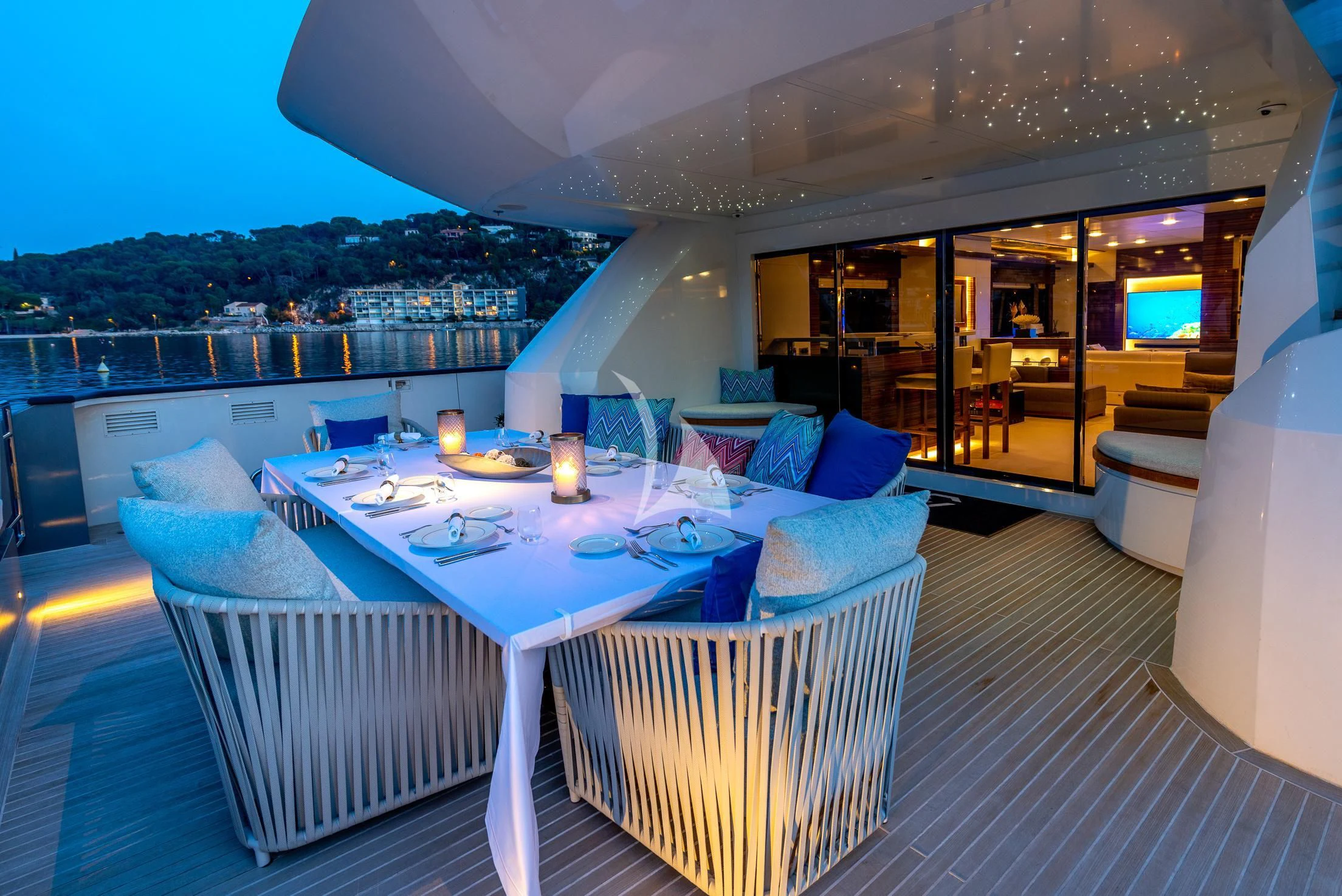 a large white table with chairs around it aboard GEMS 2 Yacht for Sale
