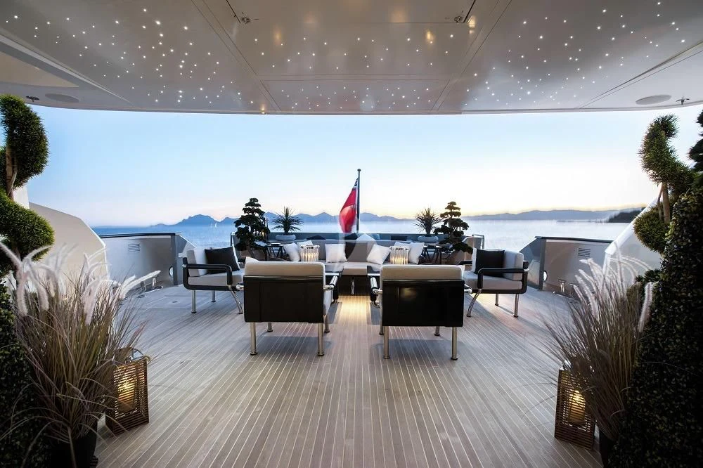 a large room with chairs and tables aboard GEMS 2 Yacht for Sale