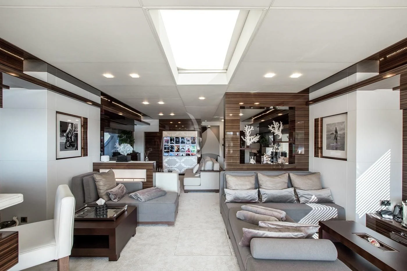 a living room with a couch and a table aboard GEMS 2 Yacht for Sale