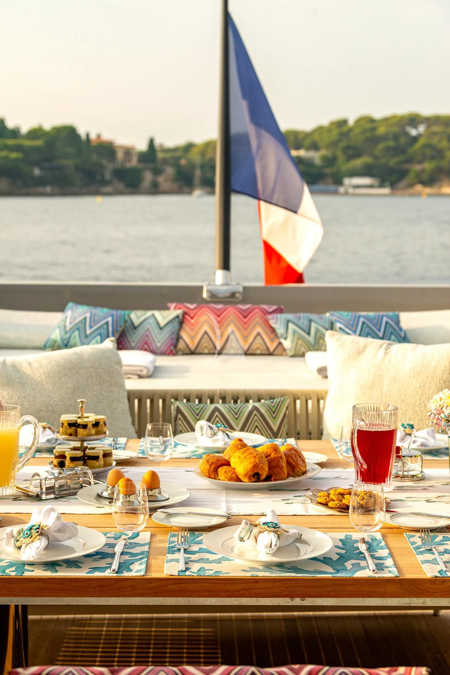 a table with food and drinks on it aboard GEMS 2 Yacht for Sale