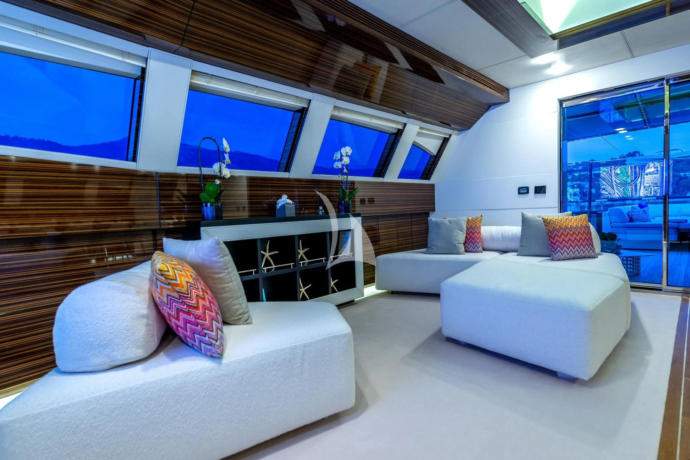 a living room with white couches aboard GEMS 2 Yacht for Sale