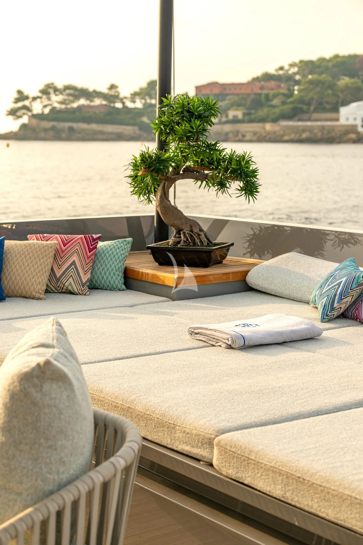 a bed with pillows and a plant on it aboard GEMS 2 Yacht for Sale