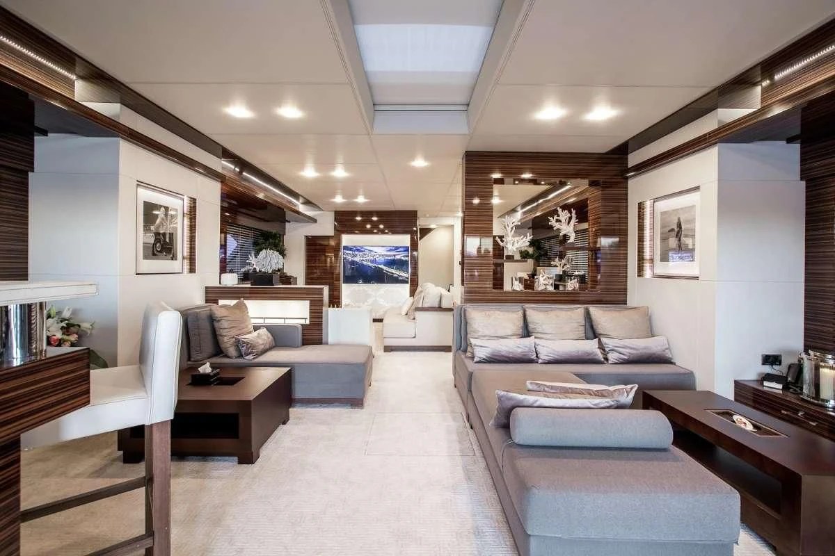 a living room with a couch and a table aboard GEMS 2 Yacht for Sale
