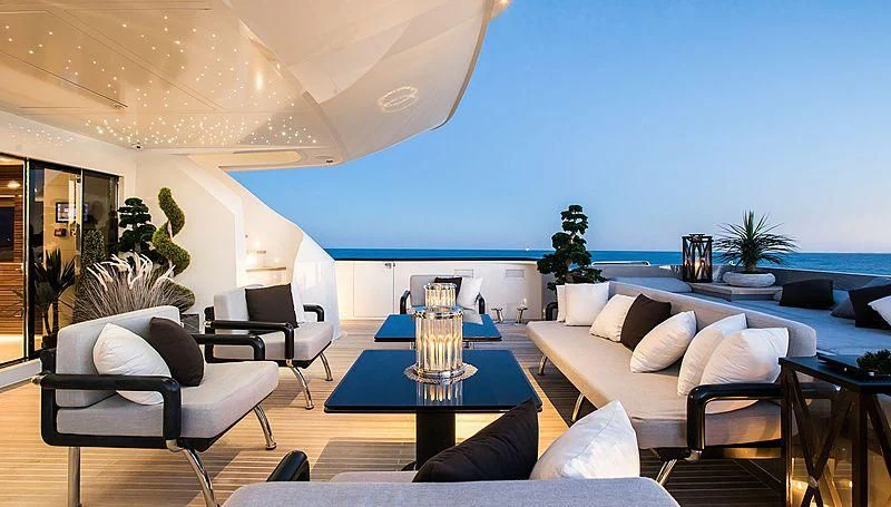 a living room with a large blue wall aboard GEMS 2 Yacht for Sale