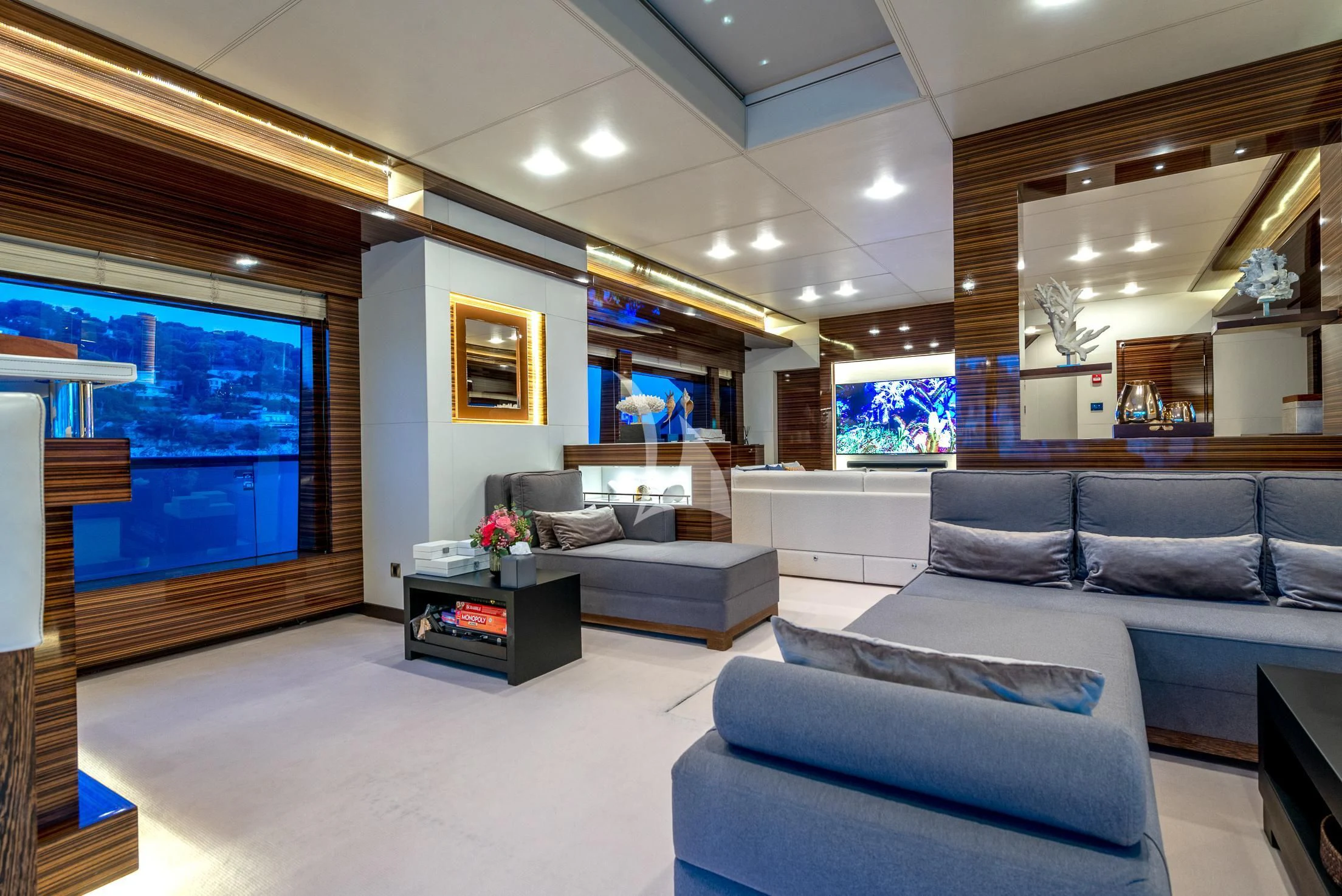 a living room with a large window aboard GEMS 2 Yacht for Sale