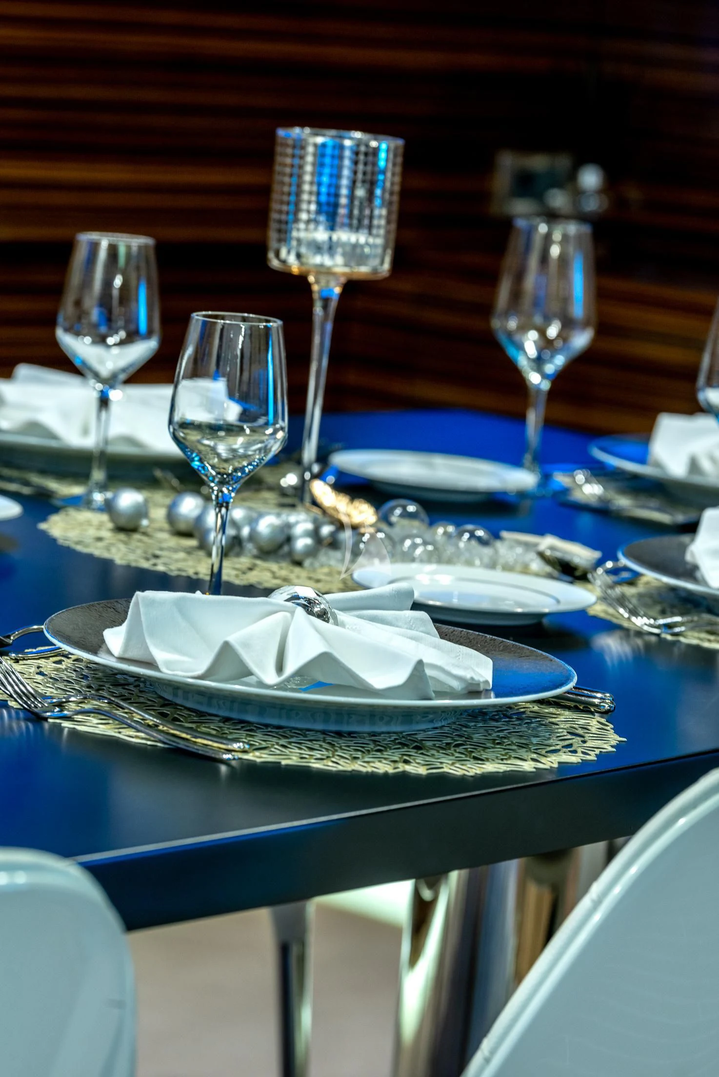 a table with plates and glasses aboard GEMS 2 Yacht for Sale