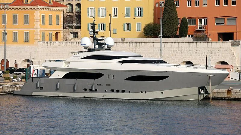 a large white boat in front of a building aboard GEMS 2 Yacht for Sale