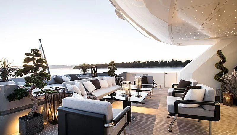 a large room with a couch and a table and chairs aboard GEMS 2 Yacht for Sale