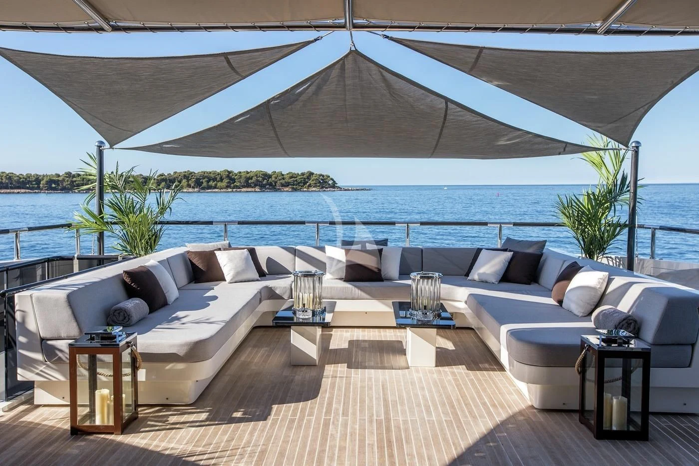 a large white couch and a table under a tent aboard GEMS 2 Yacht for Sale