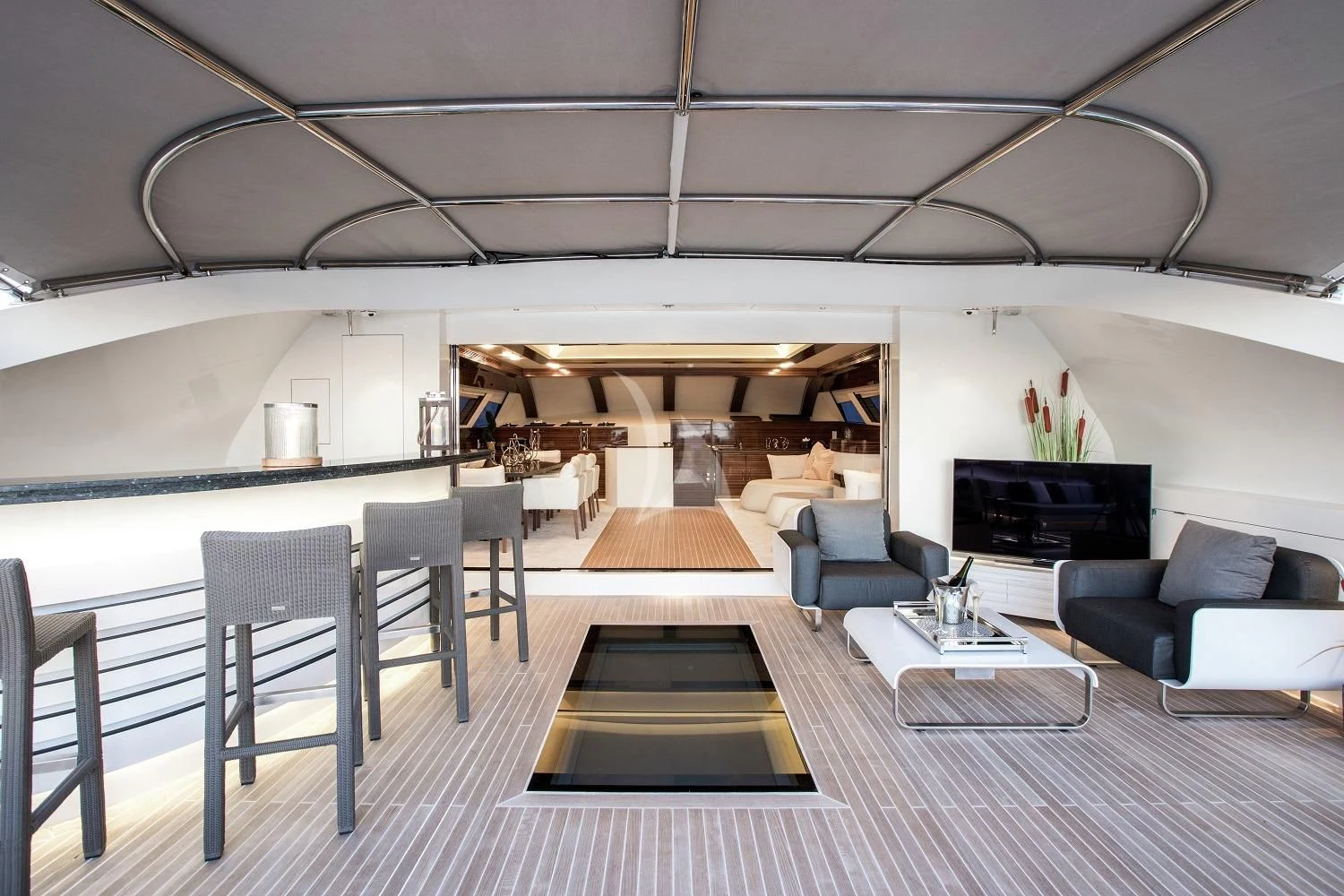 a room with a couch and a table and chairs aboard GEMS 2 Yacht for Sale