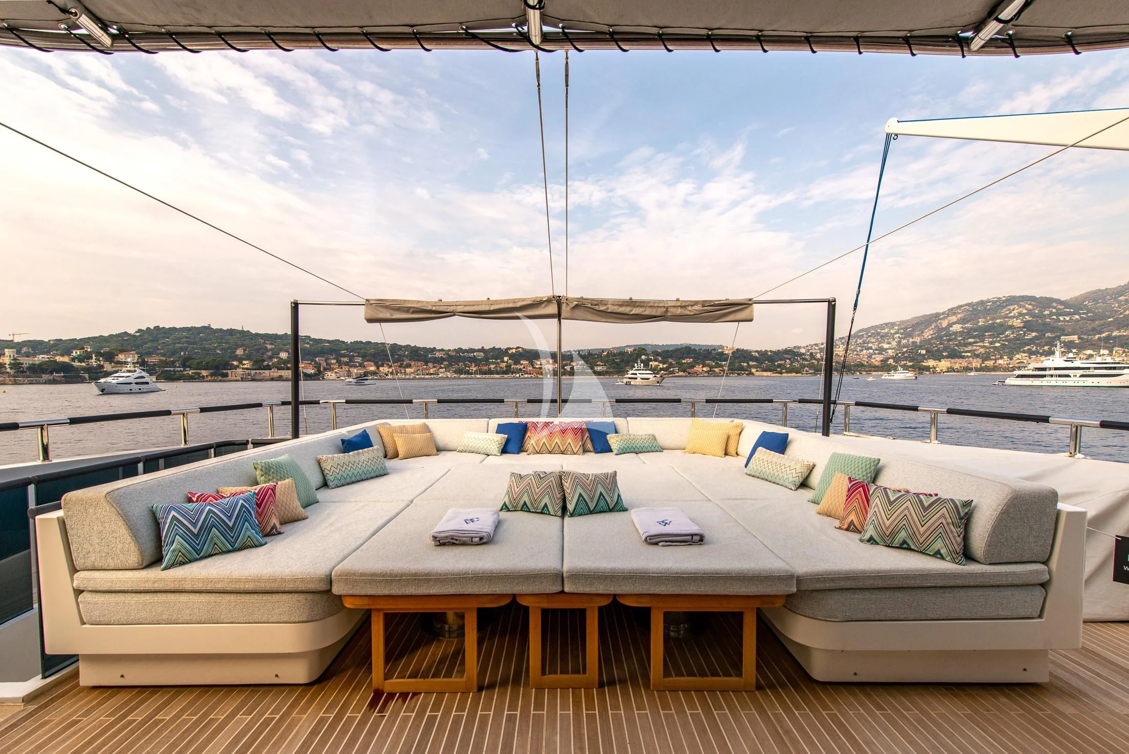 a large bed with a white cover aboard GEMS 2 Yacht for Sale