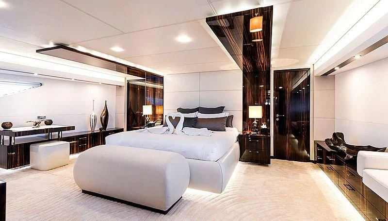 a large bedroom with a large bed aboard GEMS 2 Yacht for Sale