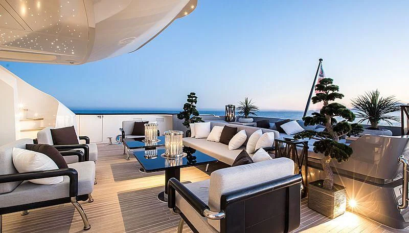 a living room with a table and chairs aboard GEMS 2 Yacht for Sale