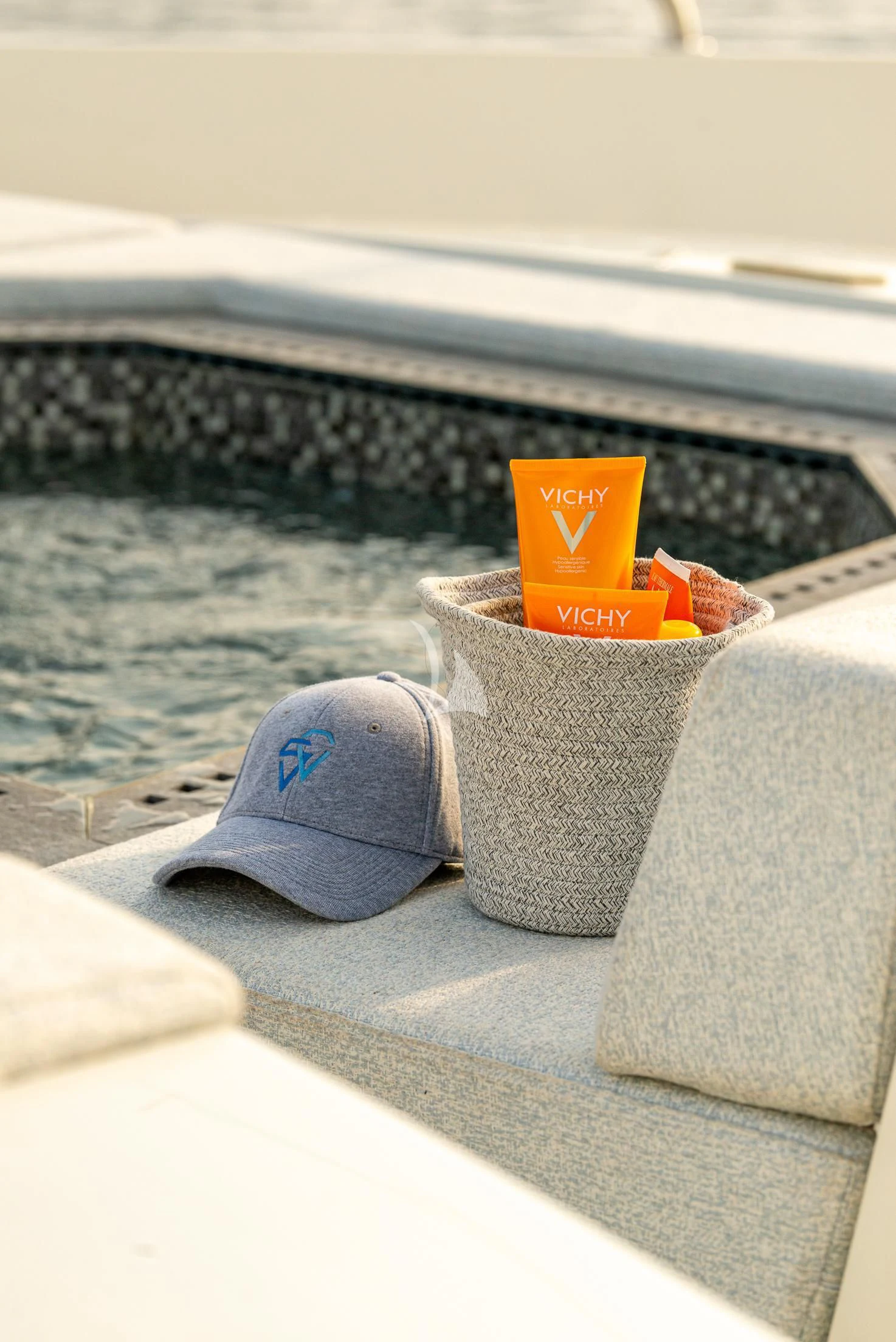 a blue hat on a table aboard GEMS 2 Yacht for Sale