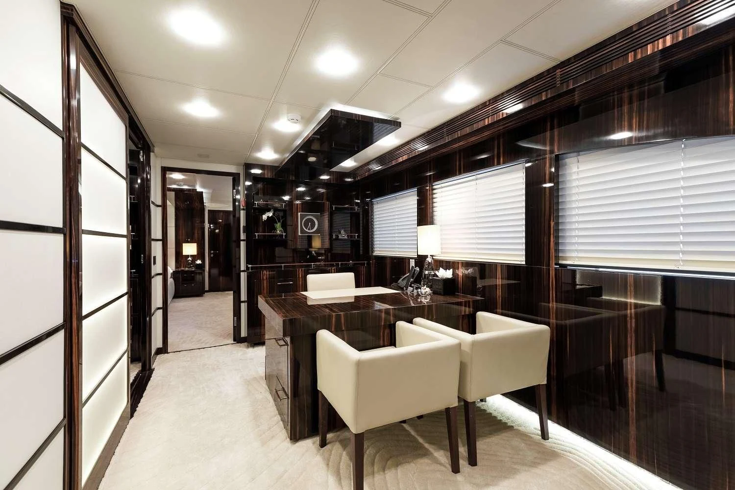 a room with a table and chairs aboard GEMS 2 Yacht for Sale