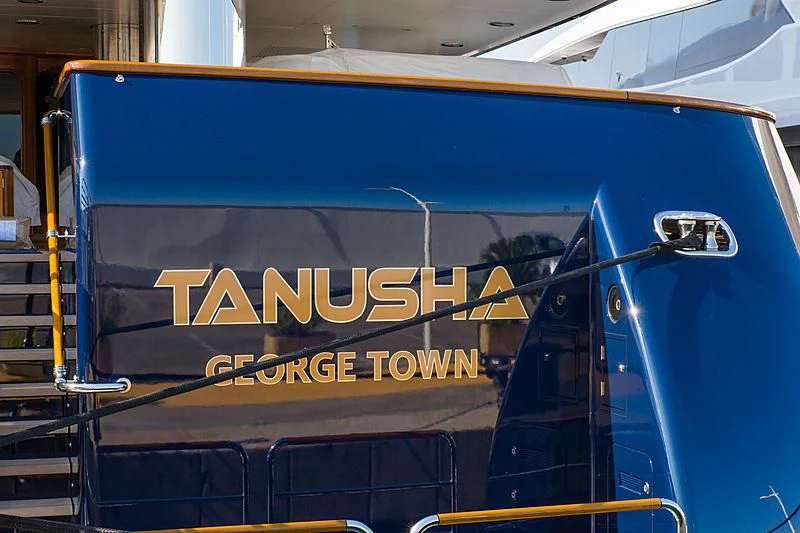 a blue truck with a sign aboard TANUSHA Yacht for Sale